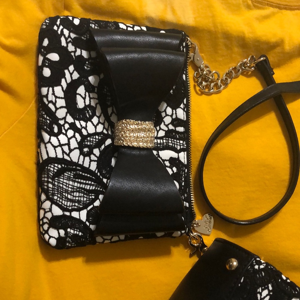 Betsy Johnson handbag with matching clutch.